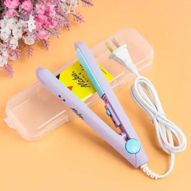 Purple hair straightener with a white cord on a yellow background